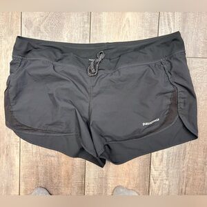 Patagonia Women's Strider athletic shorts in black.